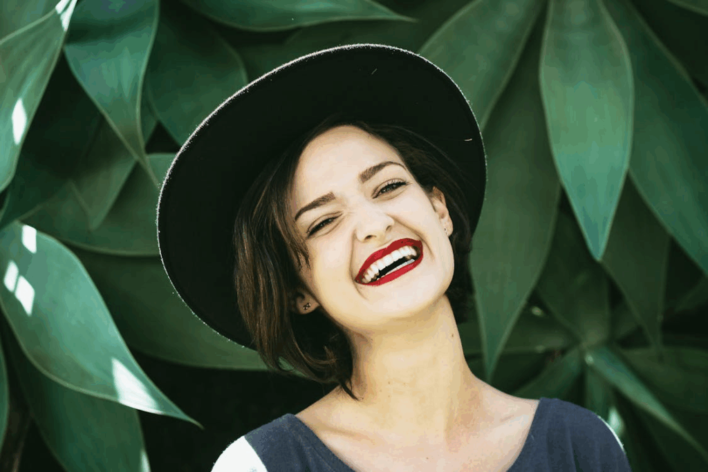 a woman smiling free from tooth pain
