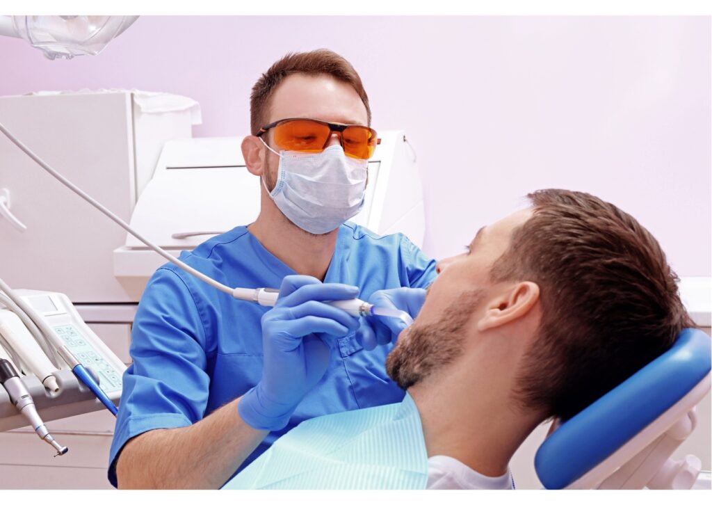 Patient receiving an oral exam during a routine first dental appointment visit