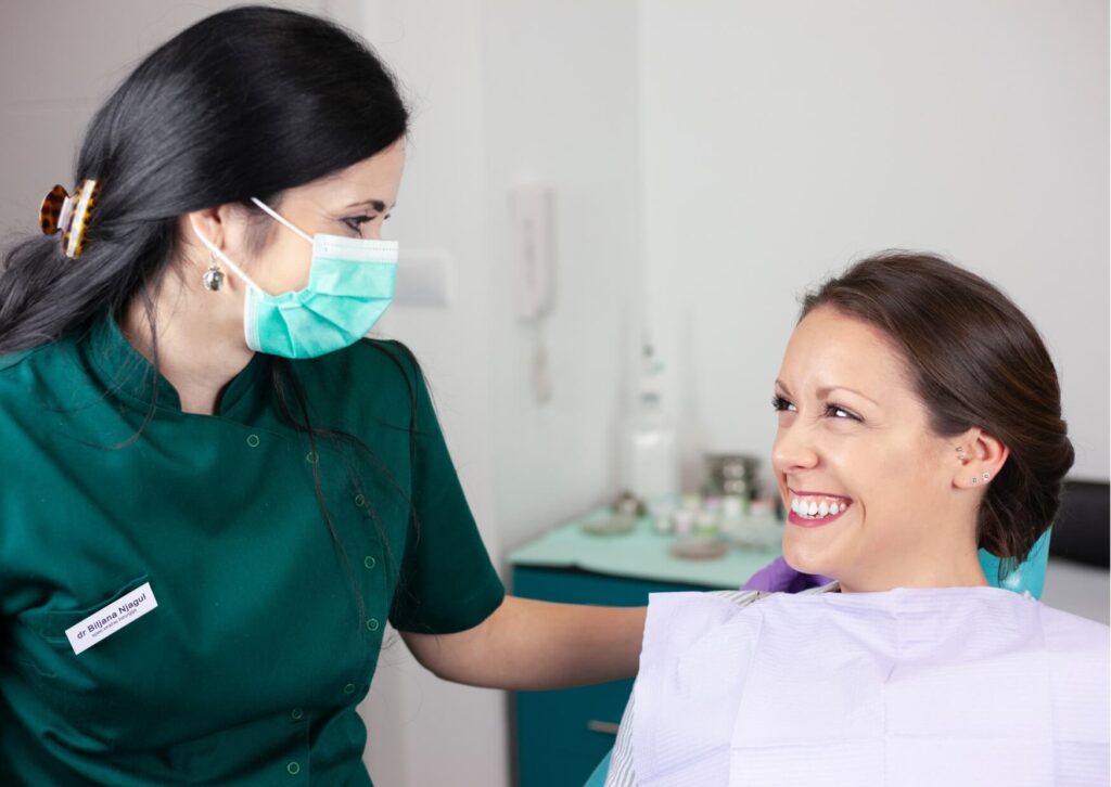 Patient consulting with a dentist before a crown procedure, discussing how long it takes to get a crown on a tooth and the steps involved in treatment.