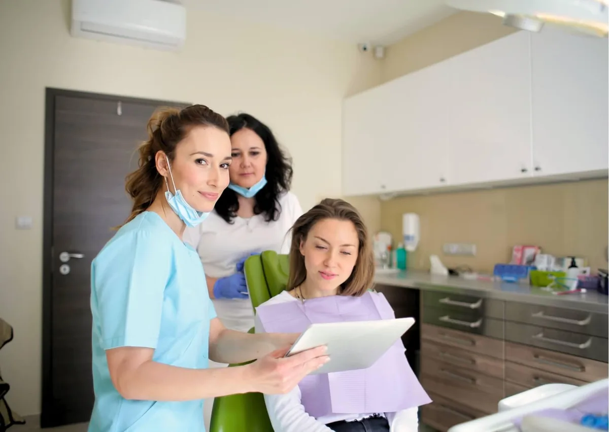 Dental team reviewing a patient’s treatment plan during a smile makeover consultation.